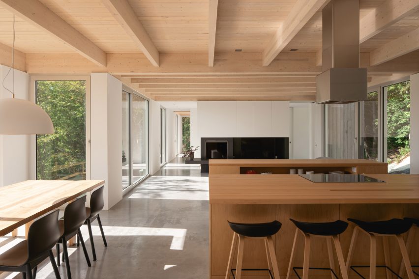 Maple kitchen islands in Forest House I by Natalie Dionne Architecture