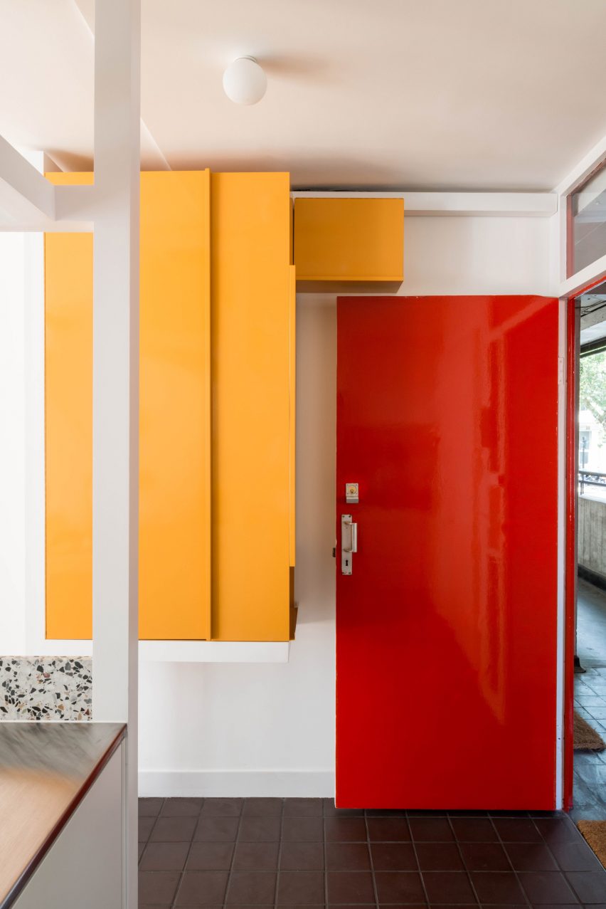 Red front door at Golden Lane flat by Archmongers