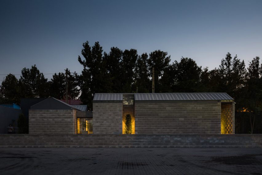 Night view of Aptus Factory Showroom by Hooba Design Group