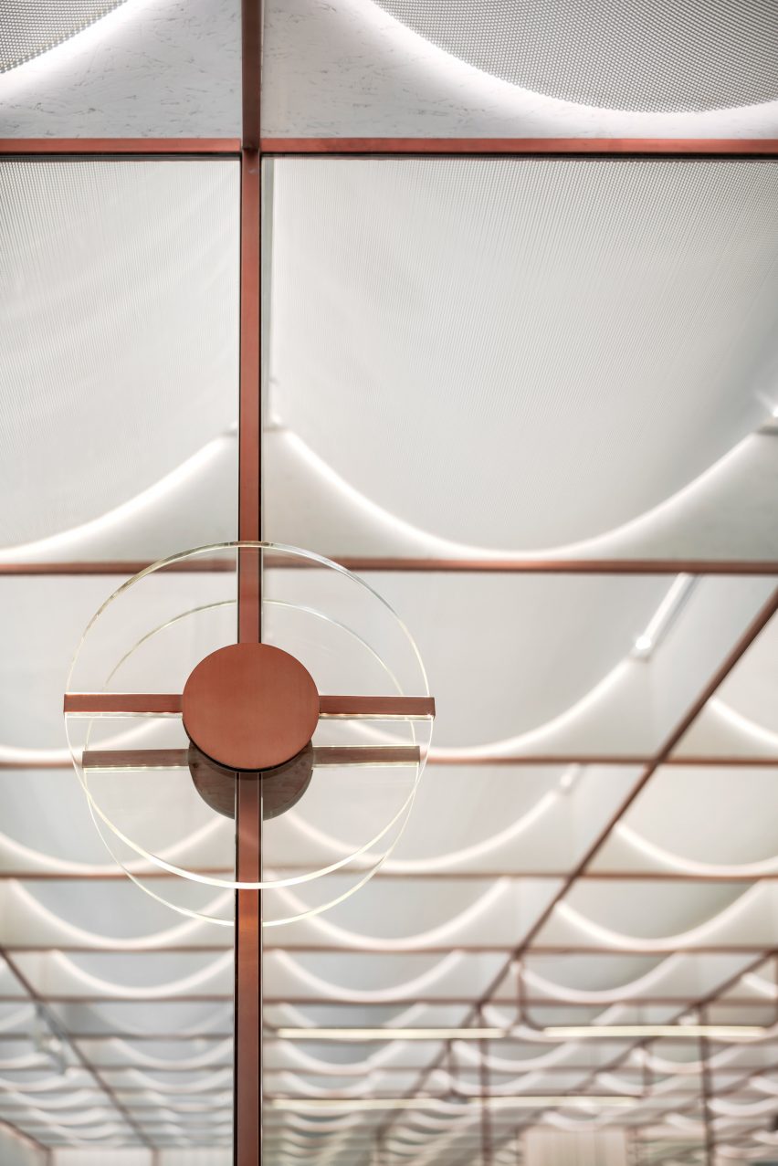 Ceiling of Infinity Wellbeing spa in Bangkok has copper detailing