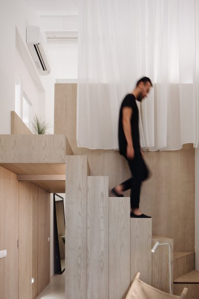 Stairs leading to mezzanine of of Project #13 by Studio Wills + Architects