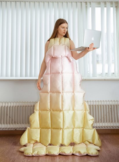 Santa Kupča wearing her Dolce Far Niente floor-length, duvet-style dress