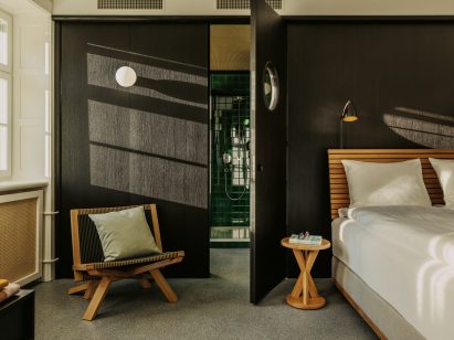 Stained black oak in bedroom of Volkshaus Basel Hotel by Herzog & de Meuron