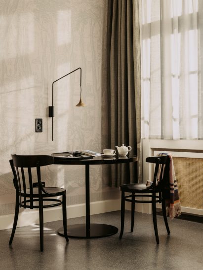 Volkshaus chairs in bedroom of Volkshaus Basel Hotel by Herzog & de Meuron