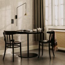 Volkshaus chairs in bedroom of Volkshaus Basel Hotel by Herzog & de Meuron