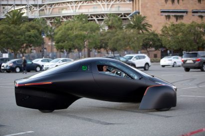 Side view of the three-wheeled solar and electric Aptera vehicle