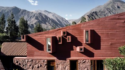 Peruvian mountains surround geometric and red Casa Huayoccari by Barclay & Crousse