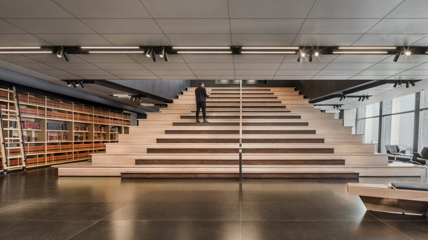 Library of law books wraps staircase in Mexico City office designed by Esrawe Studio