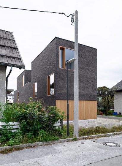 Corner view of The Double Brick House by Arhitektura