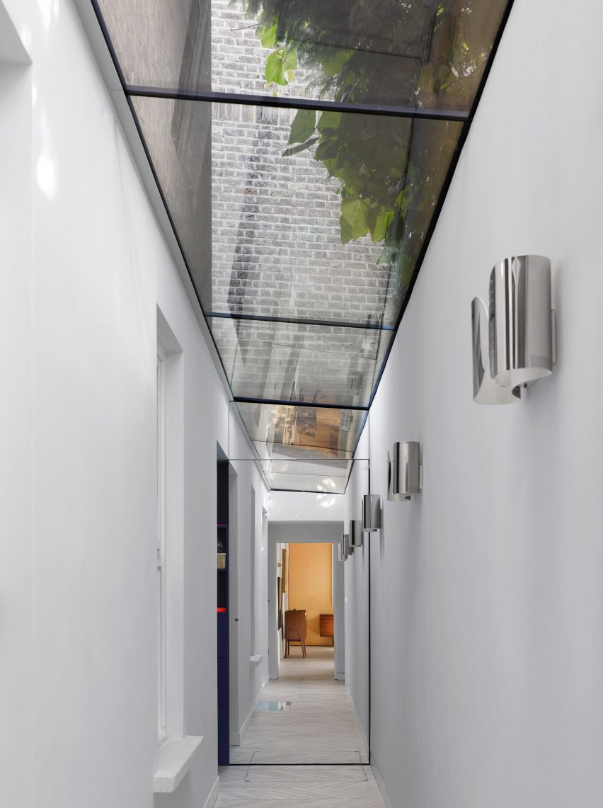 Glass-roofed garden passage in Hampstead House by Dominic McKenzie Architects