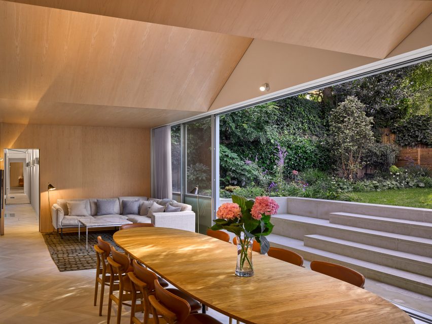 Dining room and lounge space in Hampstead House by Dominic McKenzie Architects