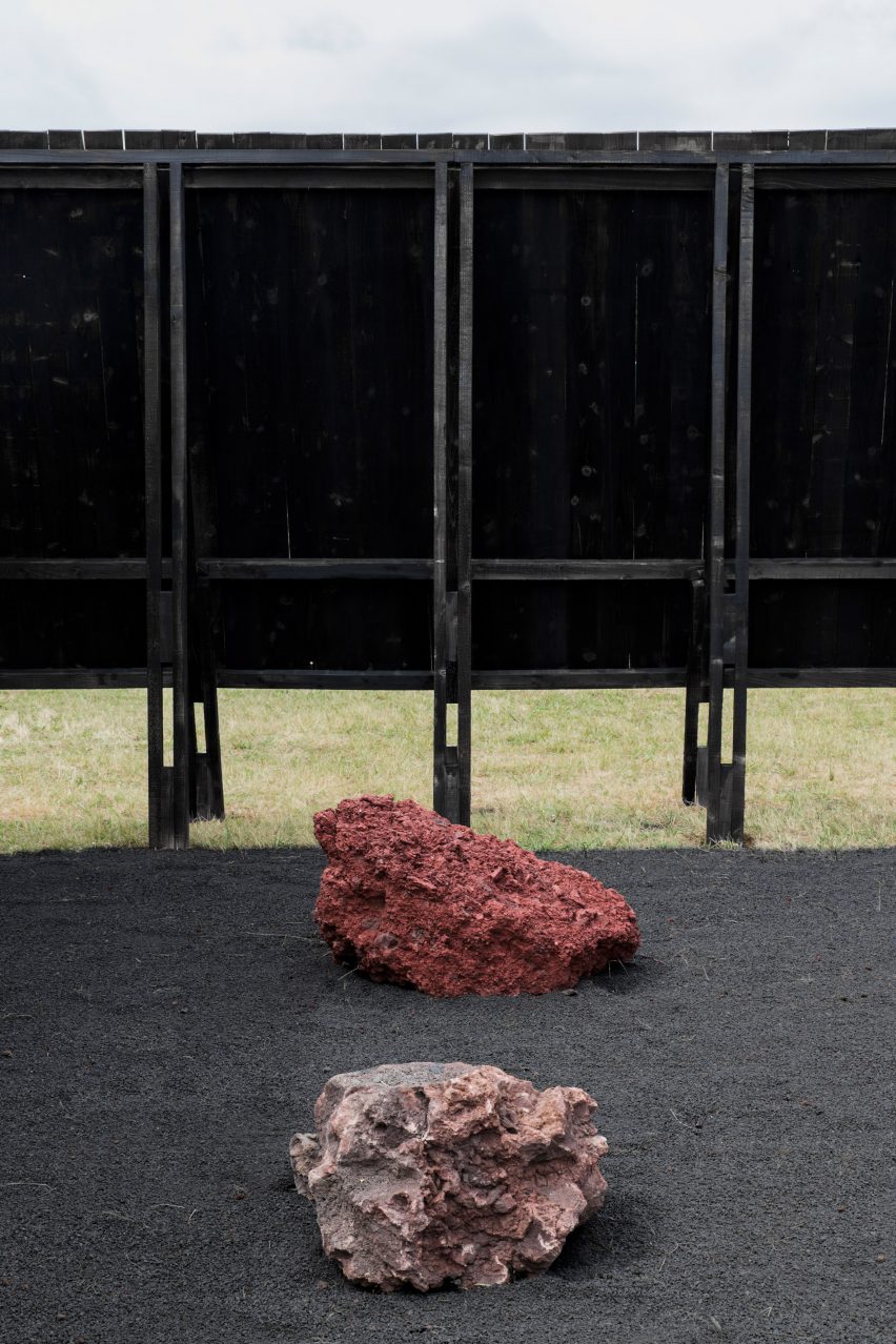 Two volcanic rocks inside the Inbetween Pavilion by Pontoatelier