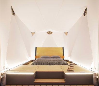 Bed inside Jupe prefabricated camping shelter