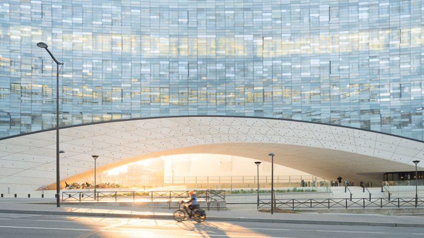Snøhetta covers arched Le Monde Group Headquarters with shimmering glass tiles