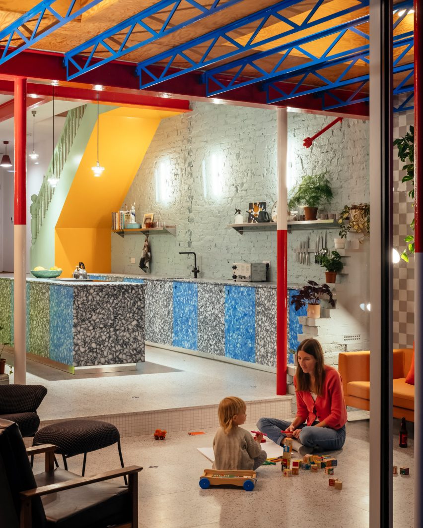 Night view of kitchen at Mountain View by CAN Architecture