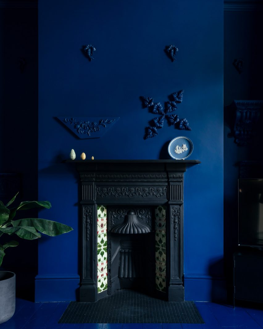 Fireplace in blue living room of Mountain View by CAN Architecture