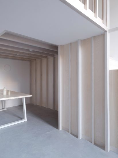 Dining area and wooden staircase from Bow Quarter interior