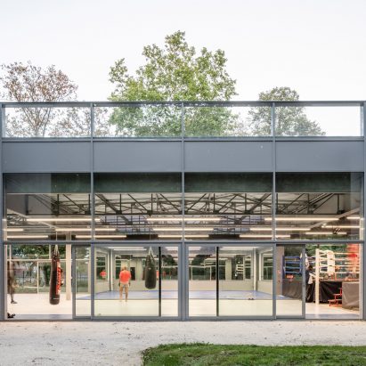 The boxing club has large glass windows