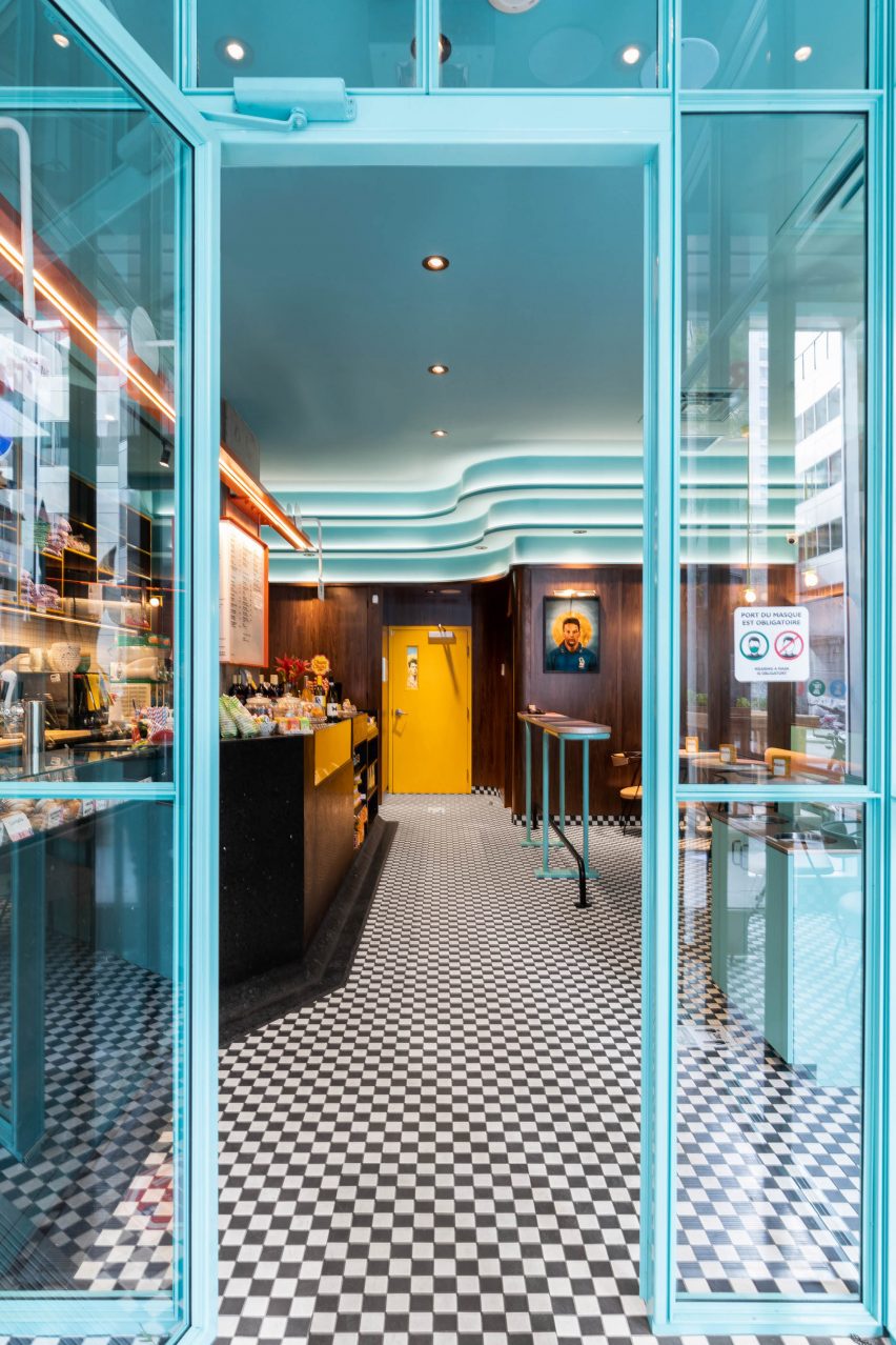 The blue glass door entrance to Caffettiera Caffé Bar