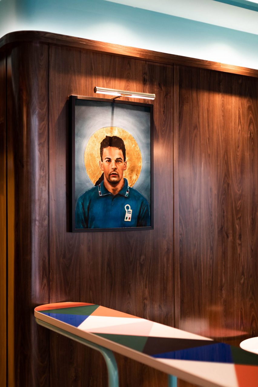 Artwork detail on the faux-wood plastic laminate walls