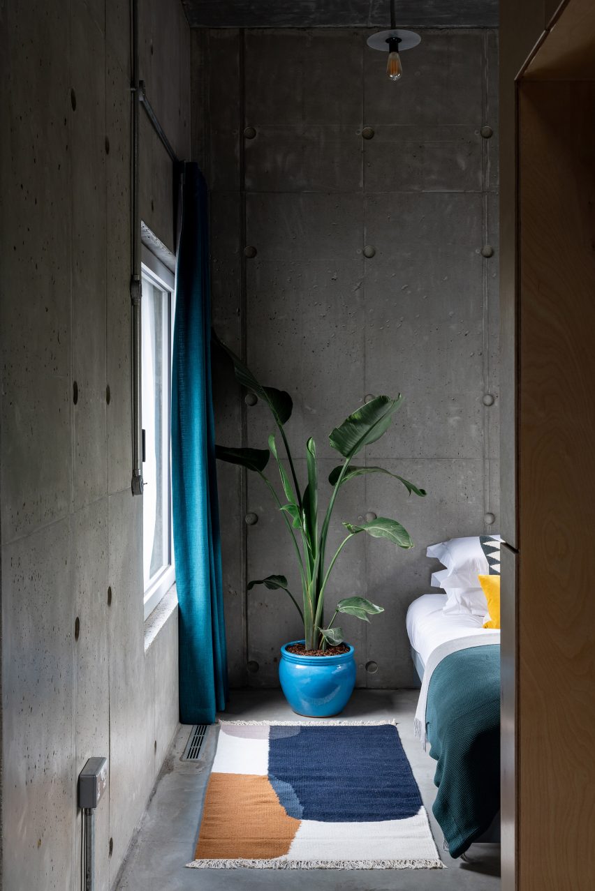 A bedroom of Concrete House by RAW Architecture Workshop in East Sussex