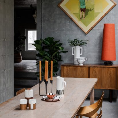 A dining area in Concrete House by RAW Architecture Workshop in East Sussex