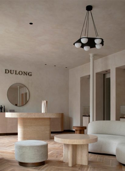 Travertine counter and table in interior by Norm Architects
