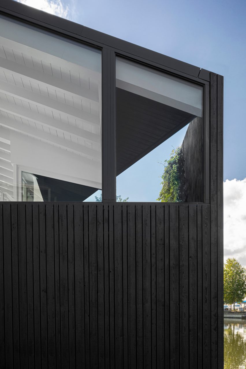 The stained-wood exterior of the floating house by i29