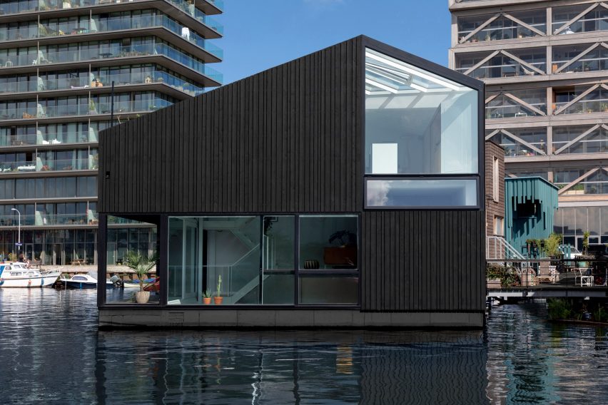 The stained-wood exterior of the floating house by i29
