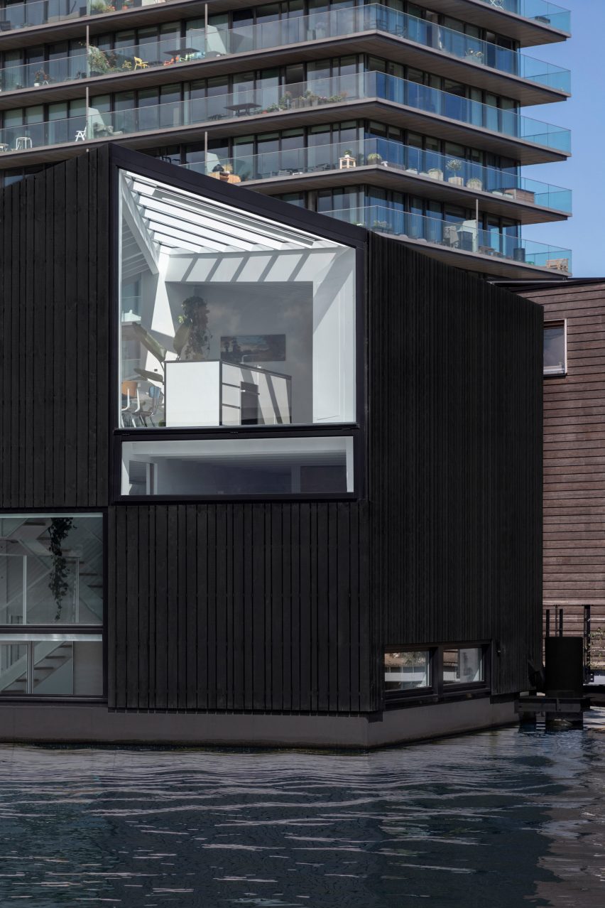The stained-wood exterior of the floating house by i29