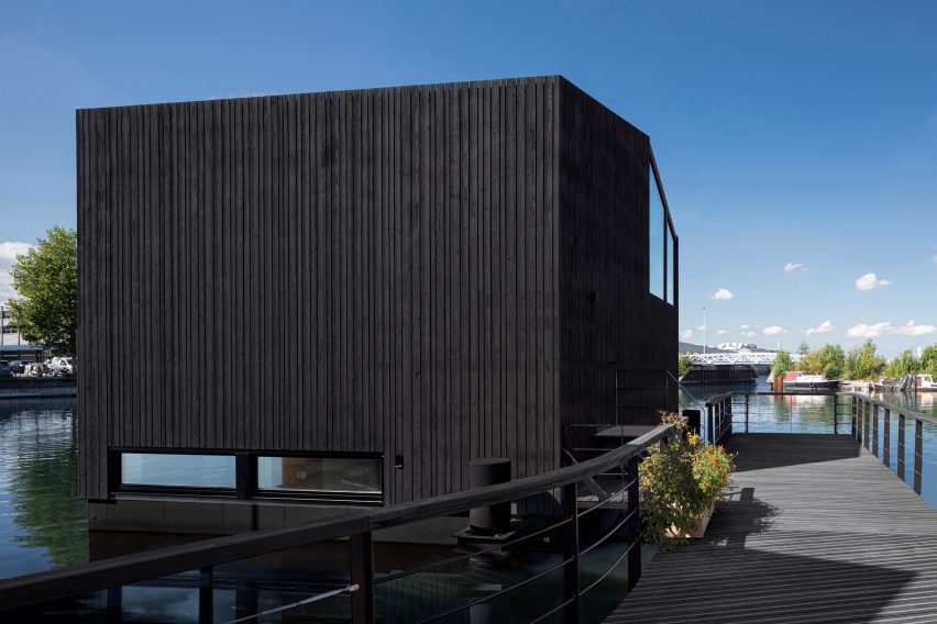 The stained-wood exterior of the floating house by i29
