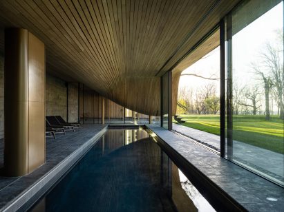 Pool and compression-bent wood cieling in floor houe