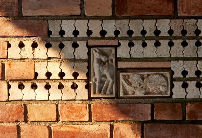 The facades are made from a combination of brick and terracotta