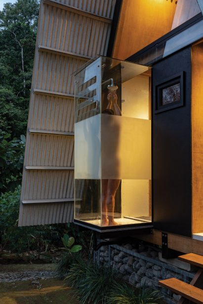 Glass-walled shower with view of landscape