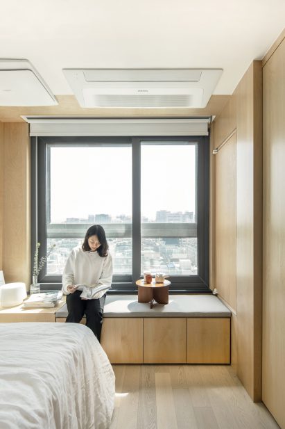 A window seat inside a LIFE micro-apartment by Ian Lee
