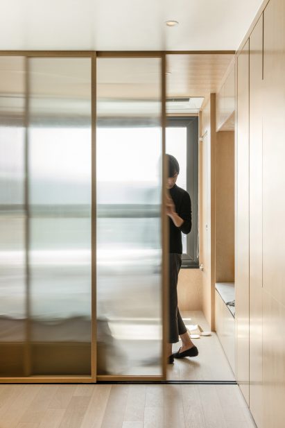 A sliding partition inside a LIFE micro-apartment by Ian Lee
