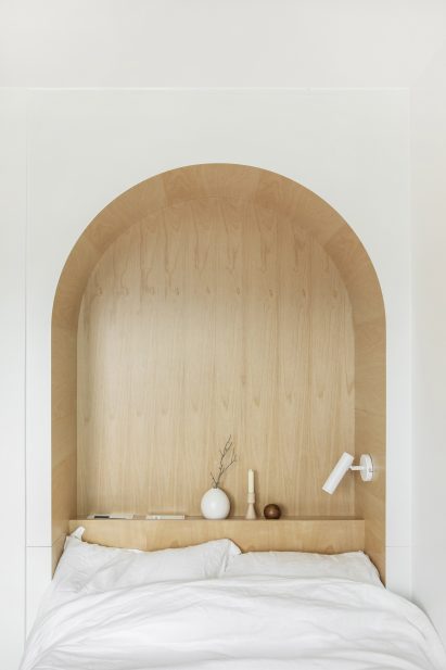 An arched cut-out inside a LIFE micro-apartment by Ian Lee