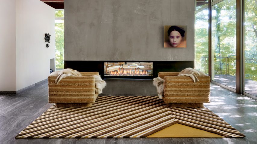 A living room with a Longworth rug by Edward Fields for Tai Ping Carpets