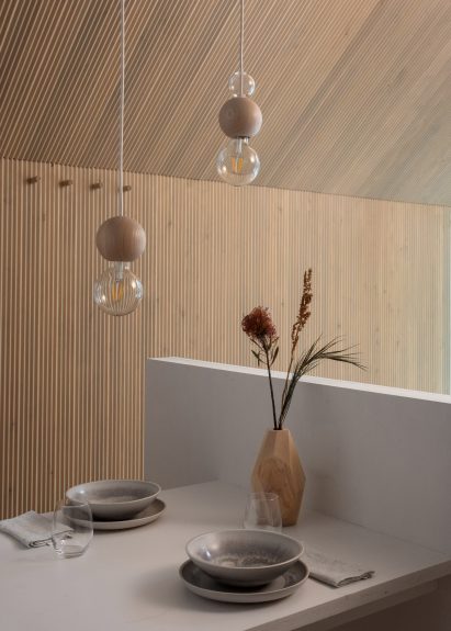 The light-wood interiors of a woodland cabin