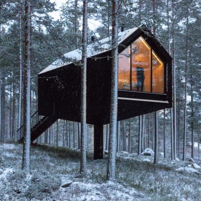 Black cabin on cantilever