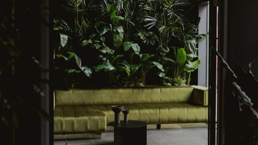 Green walls and sofa in the Urban HQ office by Kingston Lafferty Design