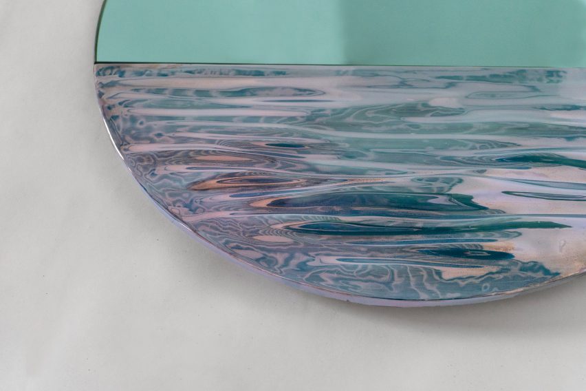 Close-up of Orizon mirror by Ocrum Studio in vivid blue