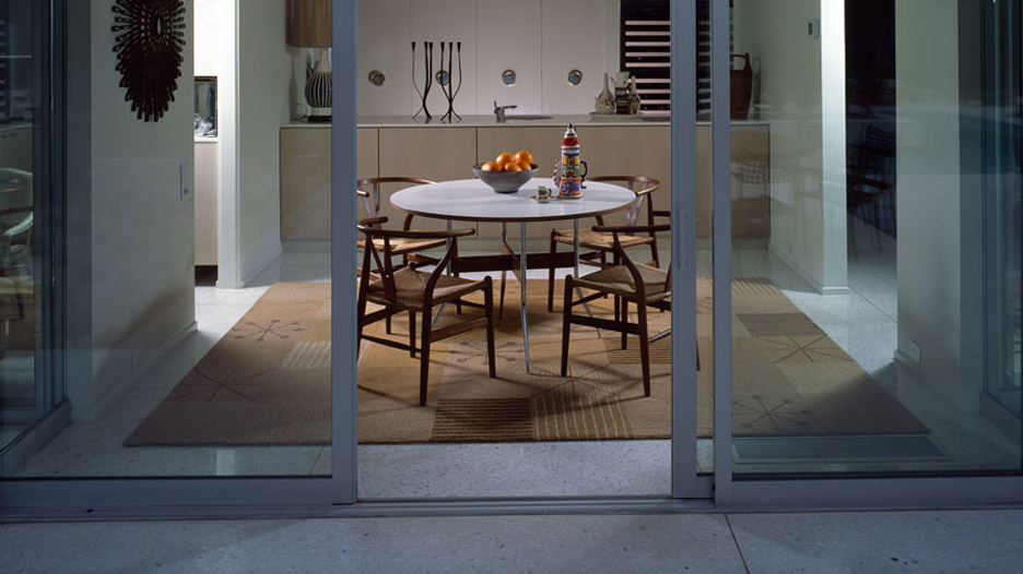 A dining room with the Picnic Blanket I rug by Raymond Loewe for Tai Ping Carpets