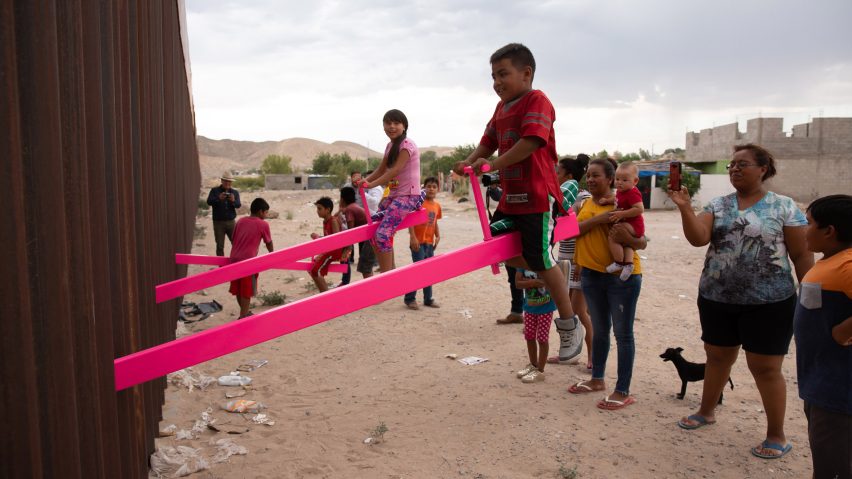 Pink seesaw installation on the US-Mexico border
