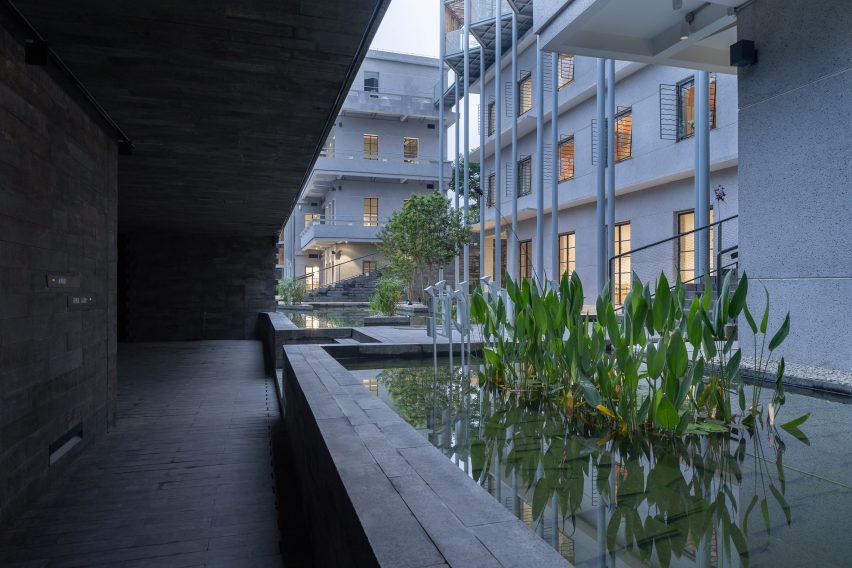 A walkway outside (Re)forming Duichuan Tea Yards centre by O-office Architects