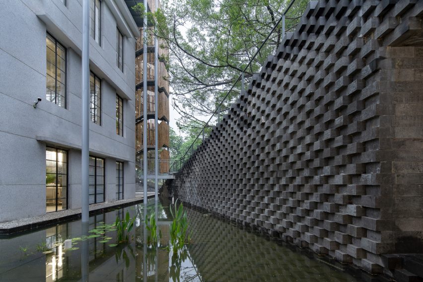 A pond outside the (Re)forming Duichuan Tea Yards centre by O-office Architects