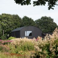 Barrel-vaulted barn at Morlands Farm in West Sussex by Sandy Rendel Architects