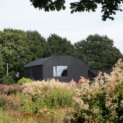 Barrel-vaulted barn at Morlands Farm in West Sussex by Sandy Rendel Architects
