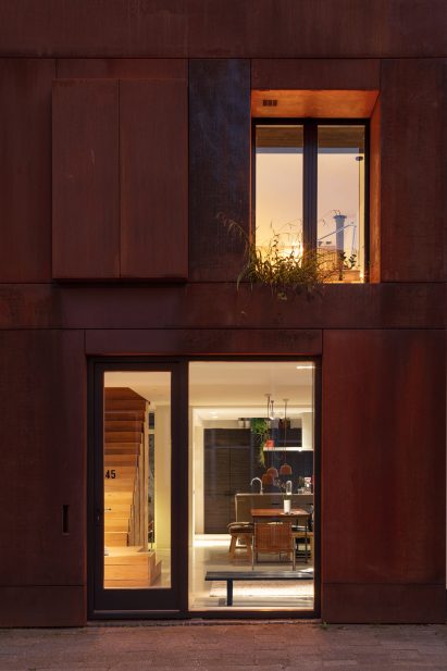 Recessed front door of Steel Craft House
