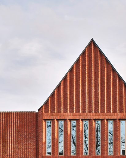 Angled brickwork within gables and horizontal soldier courses above windows